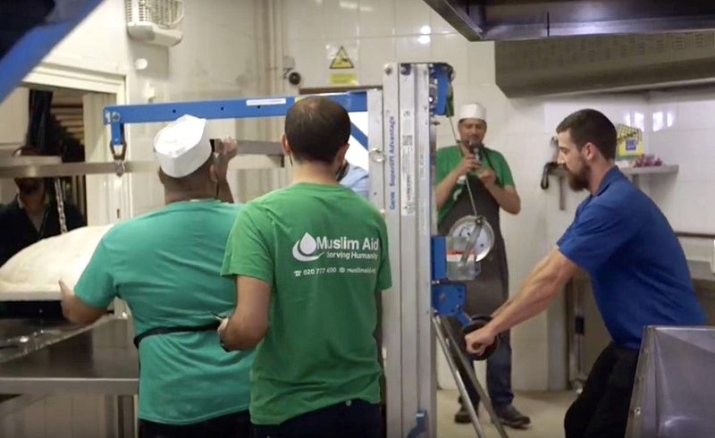 The manually operated material lift is compact and portable, allowing it to be rolled through the mosque doors in an upright position.